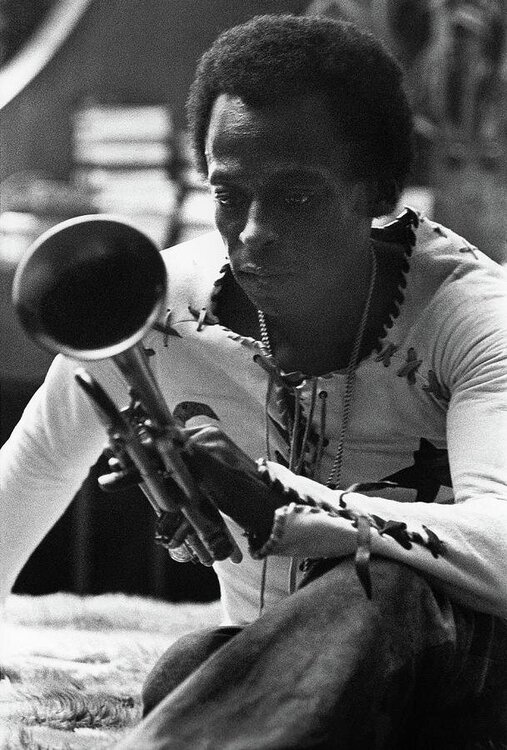 jazz-musician-miles-davis-looking-at-his-trumpet-mark-patiky.jpg